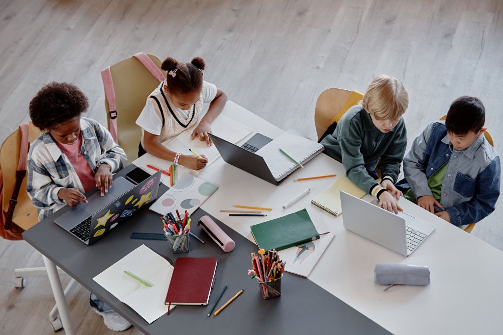 top view of children studying together at table 2025 03 09 01 35 12 utc